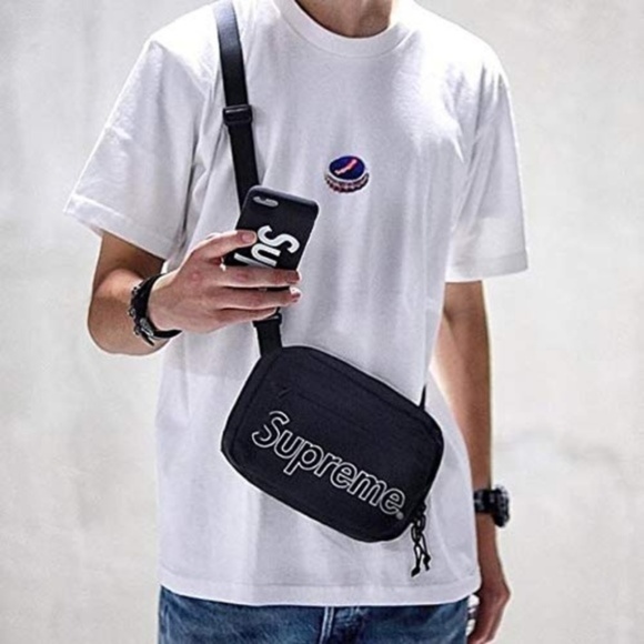 supreme shoulder bag on person